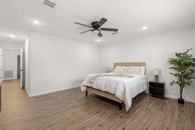 bedroom featuring wood-type flooring and ceiling fan