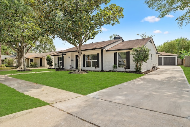 ranch-style home featuring a garage and a front lawn