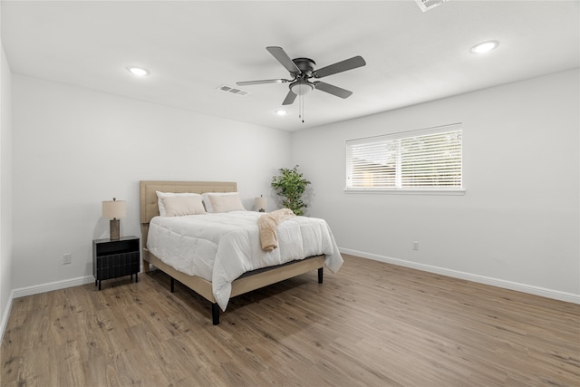 bedroom featuring ceiling fan and light hardwood / wood-style flooring