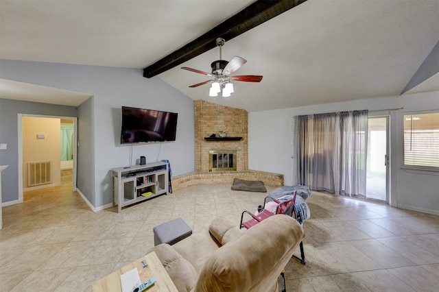 living room with ceiling fan, lofted ceiling with beams, light tile patterned floors, and a fireplace