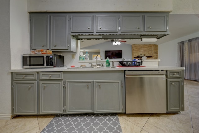 kitchen featuring appliances with stainless steel finishes, sink, and gray cabinetry