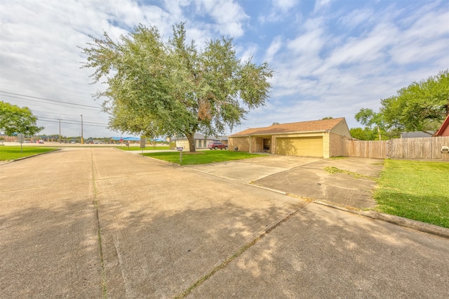 exterior space featuring a front yard and a garage