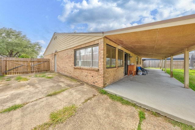 view of side of property featuring a patio area