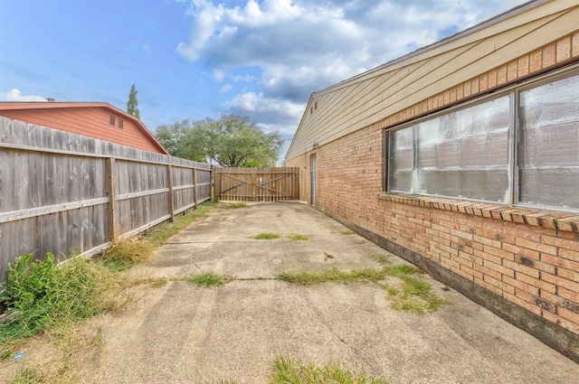 view of side of property with a patio