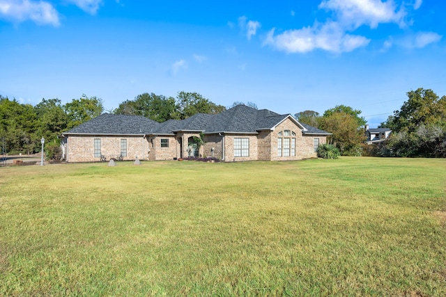 ranch-style house with a front yard