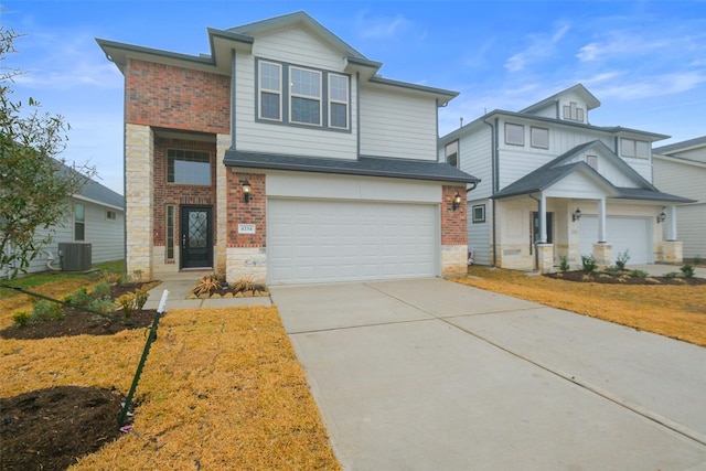 view of front of property with a garage and central AC unit