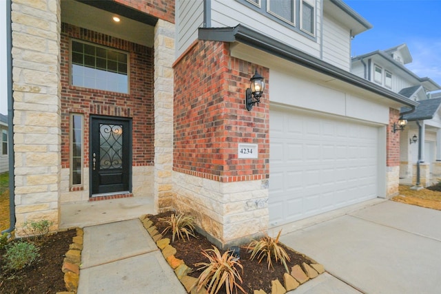 view of exterior entry with a garage