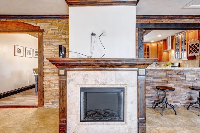 details featuring ornamental molding and tile patterned flooring