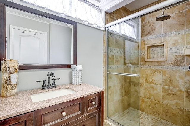 bathroom featuring vanity and an enclosed shower