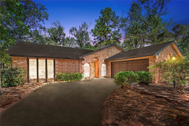 ranch-style house featuring a garage