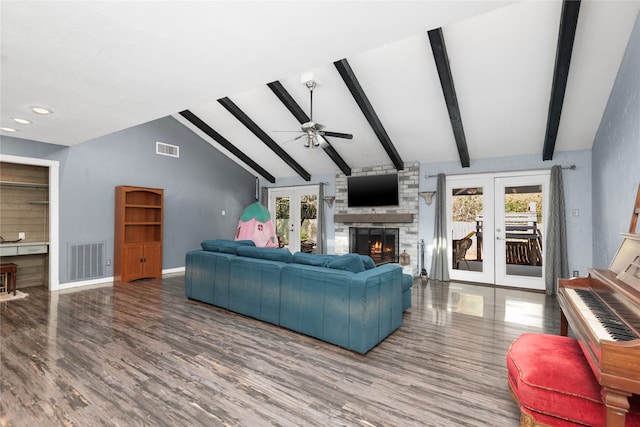 living room featuring french doors, lofted ceiling with beams, hardwood / wood-style flooring, and a healthy amount of sunlight