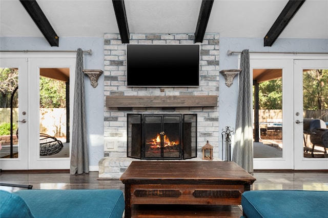 living room with french doors, beamed ceiling, and hardwood / wood-style floors