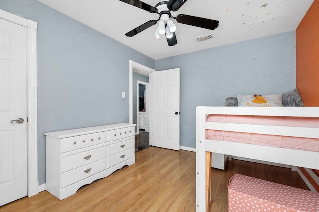 bedroom with light hardwood / wood-style flooring and ceiling fan