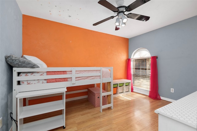 bedroom featuring light hardwood / wood-style floors and ceiling fan