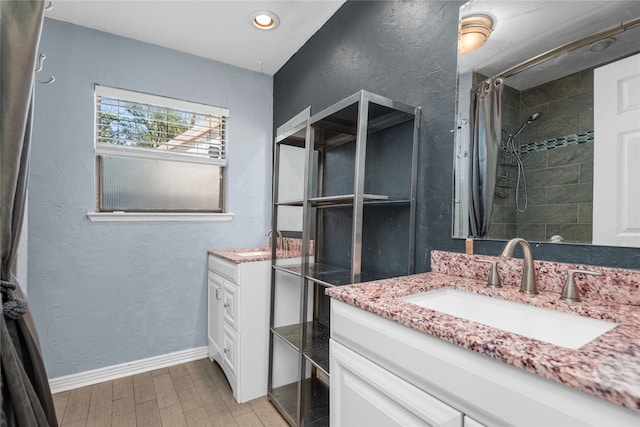 bathroom with vanity, wood-type flooring, and a shower with shower curtain