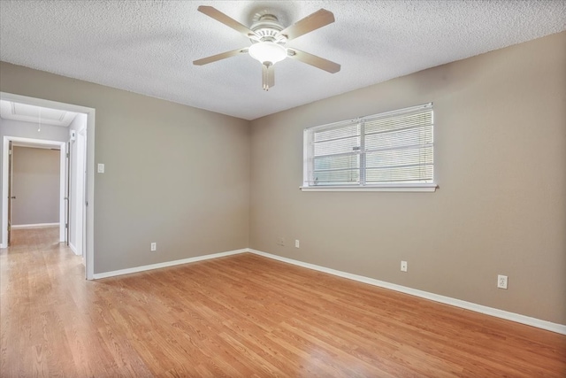 unfurnished room featuring ceiling fan, a textured ceiling, and light hardwood / wood-style flooring