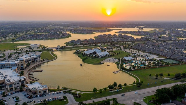 aerial view at dusk with a water view