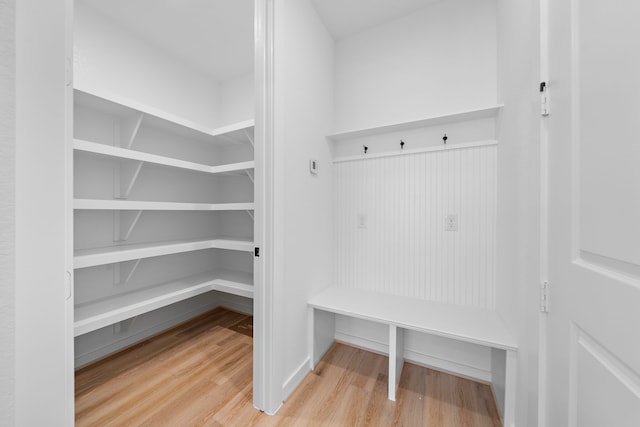 mudroom with wood-type flooring