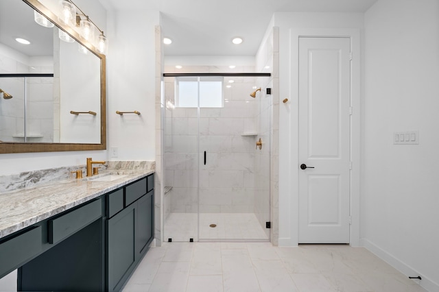 bathroom featuring vanity and an enclosed shower