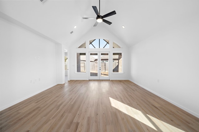 unfurnished living room featuring french doors, ceiling fan, high vaulted ceiling, and light hardwood / wood-style flooring