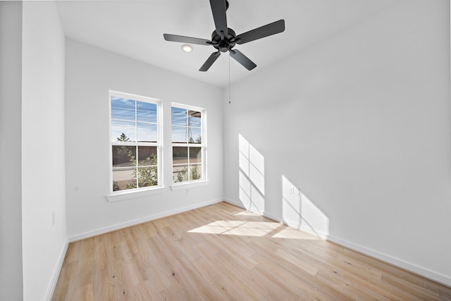 empty room featuring ceiling fan and light wood-type flooring