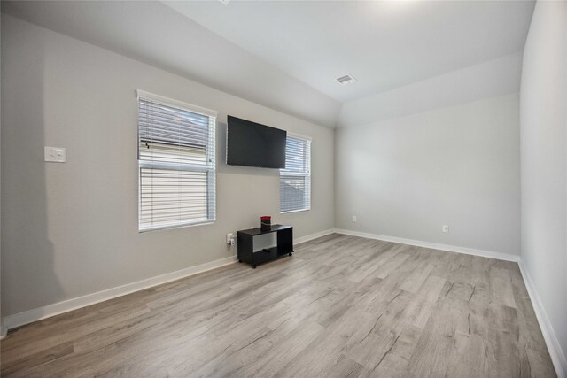 unfurnished living room with hardwood / wood-style floors