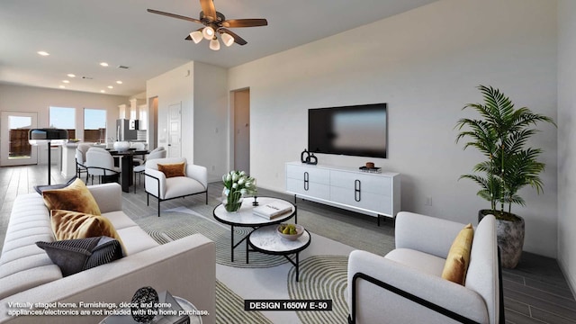 living room with wood-type flooring and ceiling fan