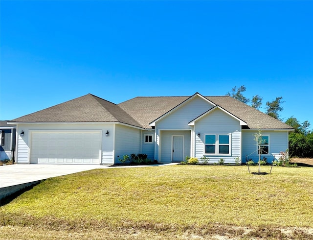 single story home with a front yard and a garage