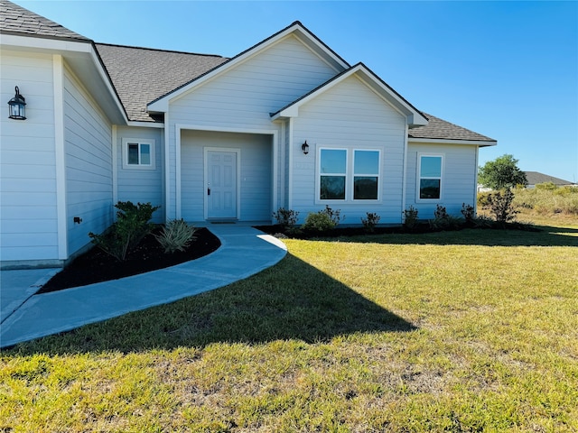 ranch-style house with a front lawn