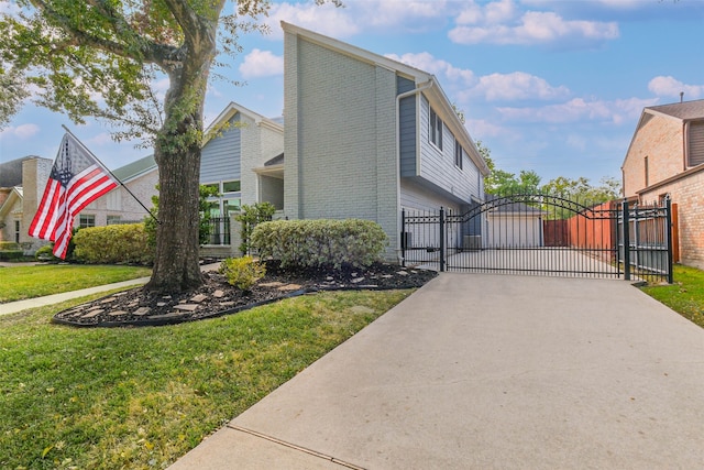 view of home's exterior with a lawn and a garage