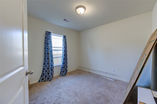 unfurnished room with carpet flooring