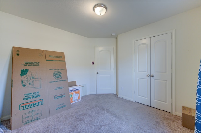 carpeted bedroom with a closet