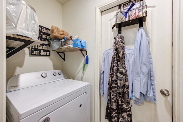 clothes washing area with washer / dryer