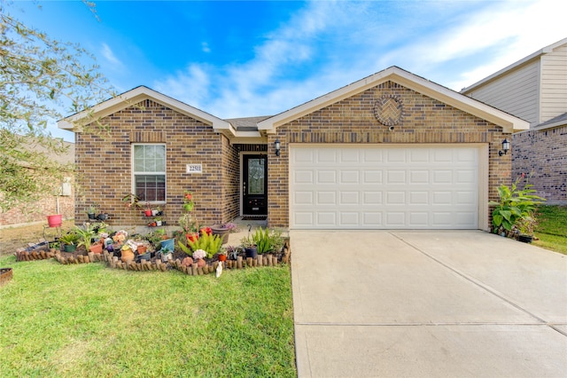 view of front of home with a garage and a front lawn