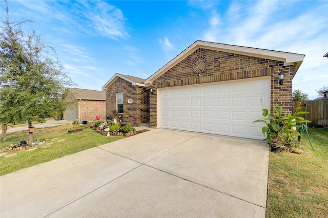 view of front of house featuring a front yard and a garage