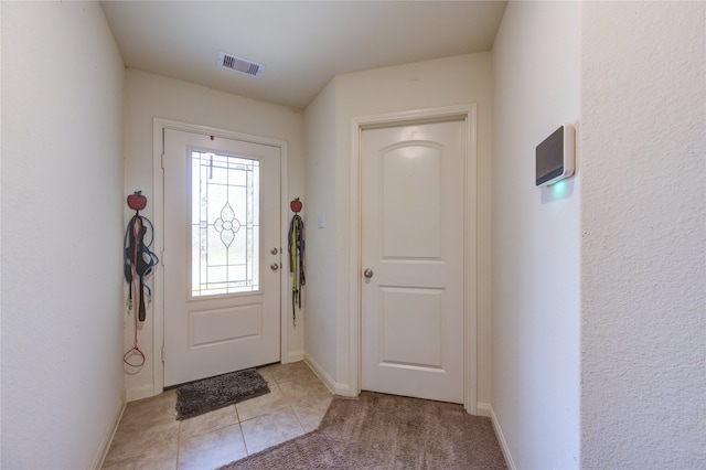 foyer with light tile patterned floors