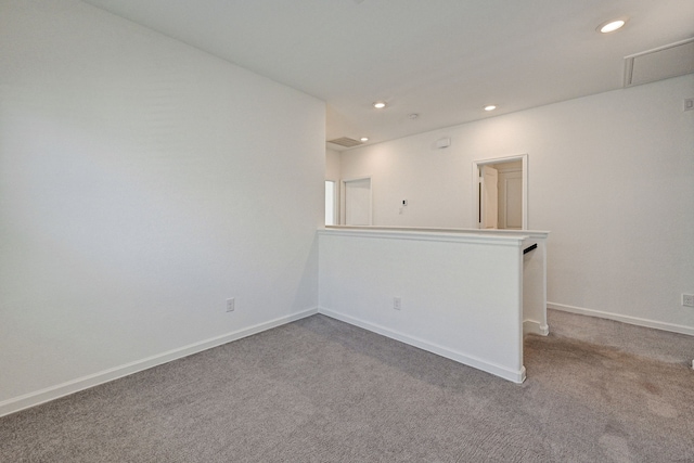 unfurnished room featuring carpet