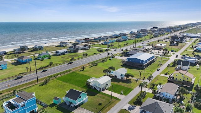 aerial view featuring a view of the beach and a water view