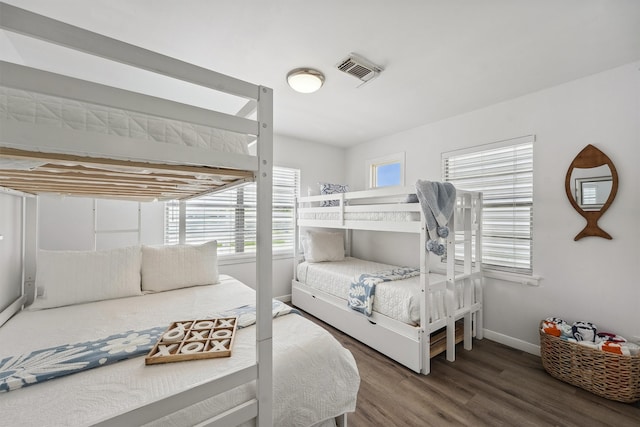 bedroom with hardwood / wood-style flooring