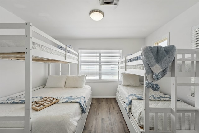 bedroom with hardwood / wood-style flooring