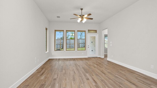 unfurnished room with light hardwood / wood-style flooring and ceiling fan