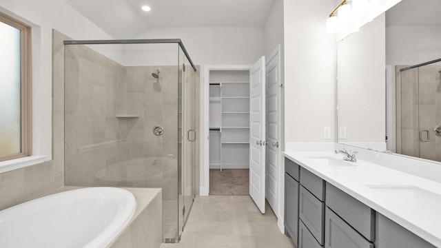 bathroom featuring independent shower and bath and vanity