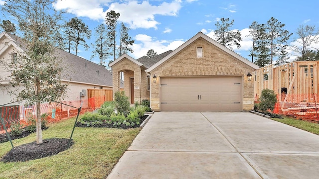 view of front facade with a garage and a front yard