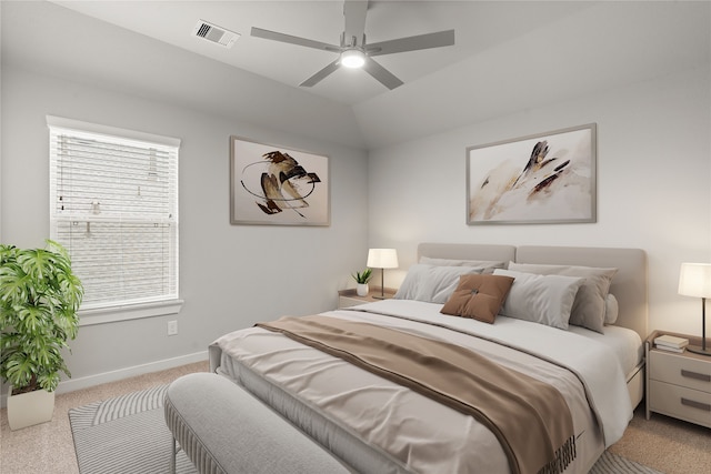 carpeted bedroom featuring lofted ceiling and ceiling fan