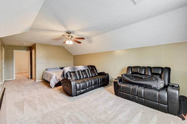 carpeted bedroom with ceiling fan, a textured ceiling, and vaulted ceiling