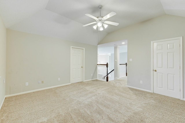 unfurnished room with light carpet, lofted ceiling, and ceiling fan