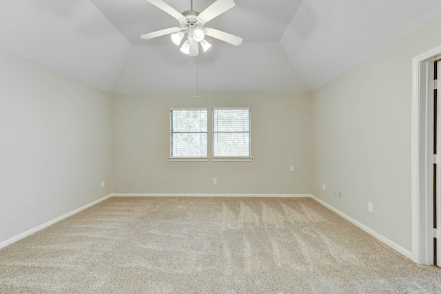 unfurnished room featuring light carpet, vaulted ceiling, and ceiling fan