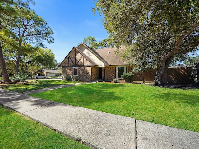 view of front of home with a front lawn and a garage