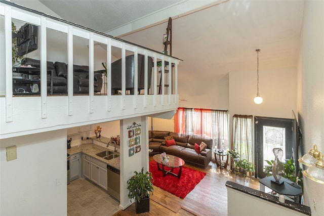 living room with sink and hardwood / wood-style floors