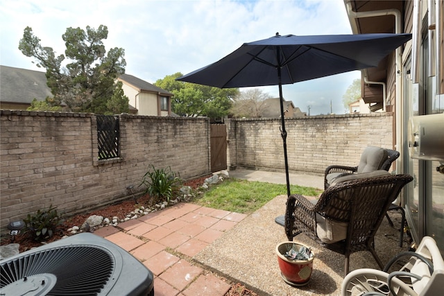 12638 Newbrook Dr, Houston, TX 77072 - view of patio featuring central air condition unit, a gate, and a fenced backyard